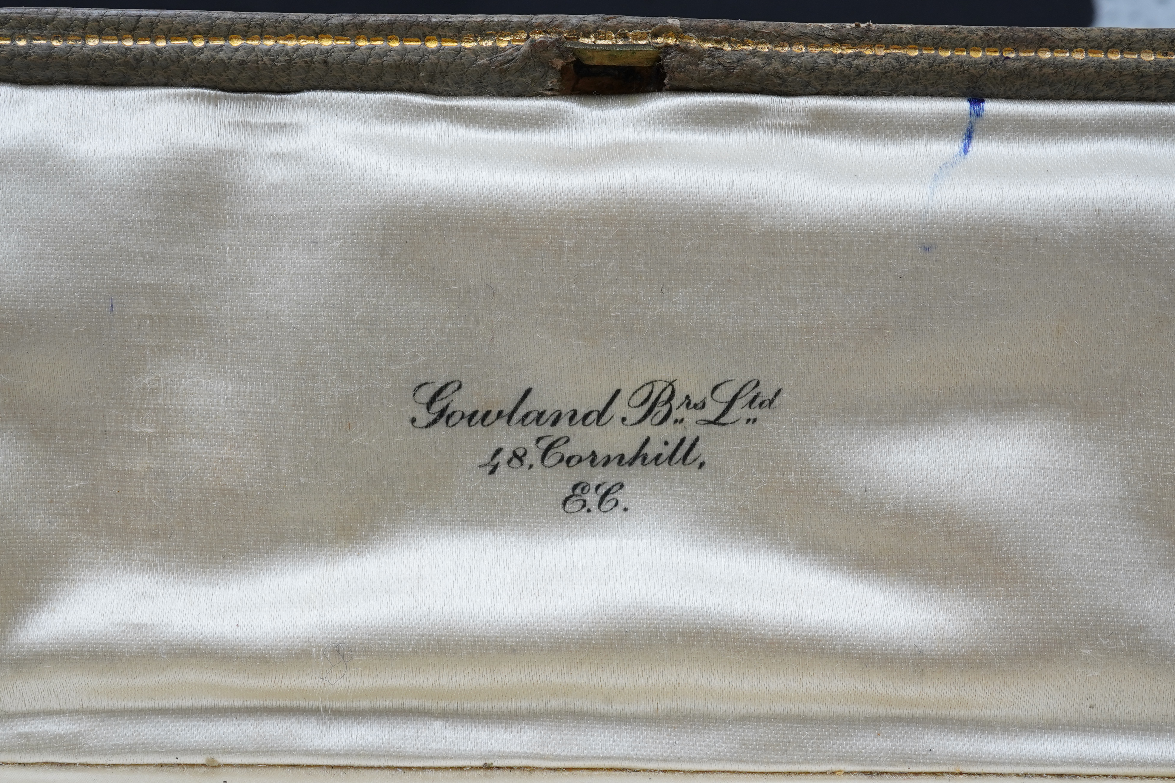 A fine Art Deco carved emerald and diamond jabot pin, circa 1925